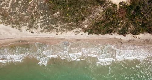 Top Down View of Waves Breaking in the Sand, Flying Over Tropical Sandy Beach and Waves