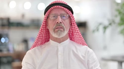 Adult Man Gesturing and Talking to Camera