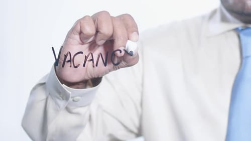 Asian Businessman Writes Vacancy