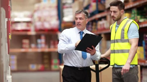 Warehouse Worker Talking With his Manager