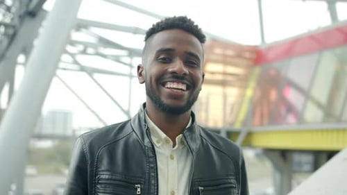 Young Adult Man Smiling Portrait in an Urban Setting