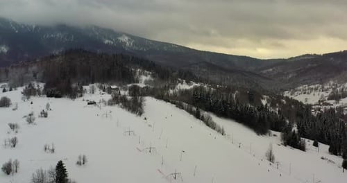 Forest Covered with Snow Aerial View. Aerial View of Village in Mountains
