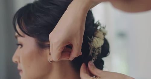 Professional Hairdresser Working With Asian Bride On Wedding Day.