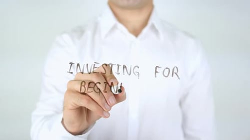 Writing Investing for Beginners on Transparent Glass Surface