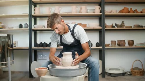 Pottery Workshop Man Ceramist Makes a Pitcher Out of Clay Handicraft Production of Handmade