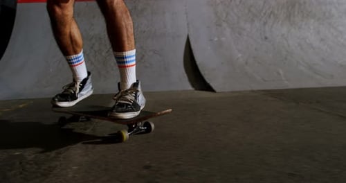 Man practicing skateboarding in skateboard arena 4k