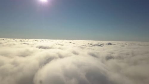Aerial View From Above of White Puffy Clouds in Bright Sunny Day
