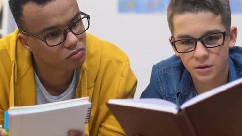 Two Best School Friends Preparing for Upcoming Exams, Doing Homework Together