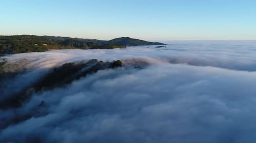 Aerial View of Mountains in Morning Fog