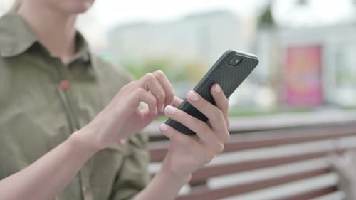 Close Up of Woman Using Smartphone Outdoor