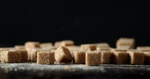 The Cane Brown Sugar in Cubes on the Table Rotates