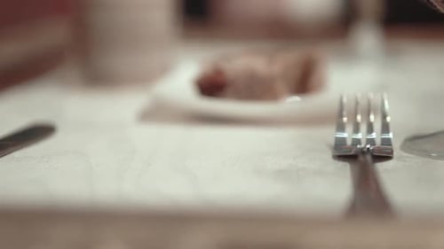 Waiter at the Restaurant Sets the Table Closeup Slow Motion