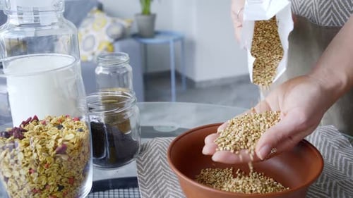 Making Healthy Breakfast With Granola and Buckwheat