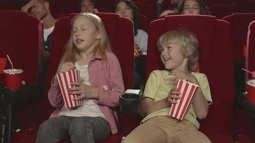 Kids Having Fun in Cinema