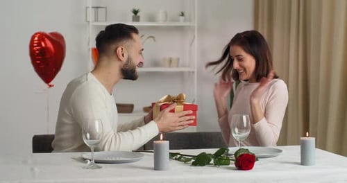 Loving Couple Celebrating an Anniversary with Gift