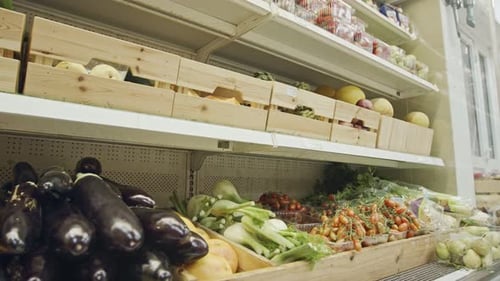 Large variety of vegetables and fruits on a supermarket shelves