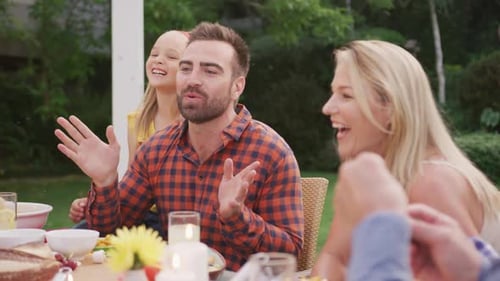 Happy Family Sharing Meal in a Sunny Garden