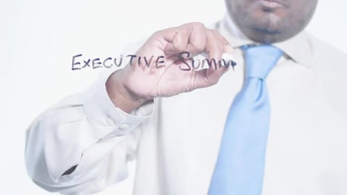 Executive Summary Writing on Glass Close Up