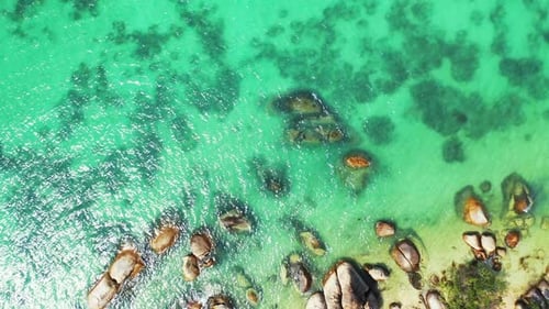 Beautiful sea scenery of old limestone cliffs plunged on shore of tropical island, washed by clear t