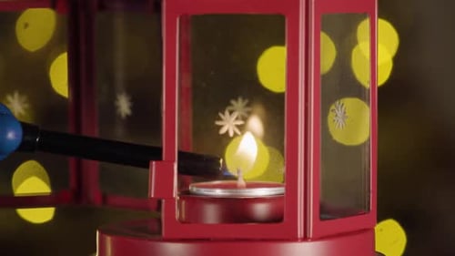 Lighting a Christmas Candle in Festive Lantern