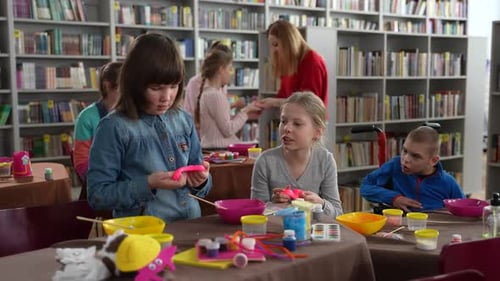 Children Doing Arts and Crafts in Library