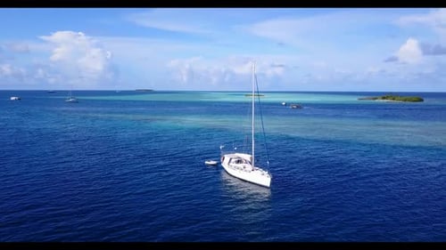 Aerial drone shot travel of beautiful coast beach adventure by aqua blue sea and clean sand backgrou