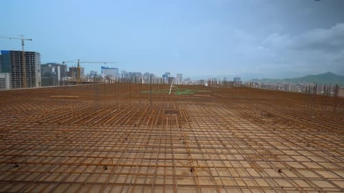 Iron reinforcement is basis for pouring foundation of house with concrete slab.