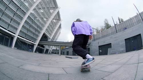 Young Adult Skateboarding in an Urban Setting
