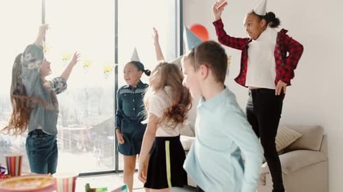 Cheerful Children Celebrate Birthday Party with Balloons and Fun