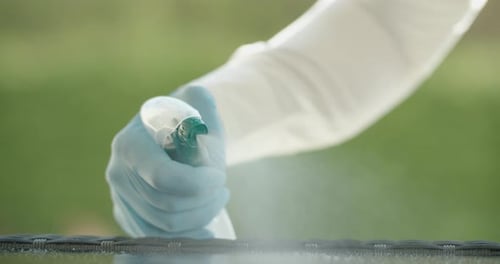Spraying Disinfectant Cleaner