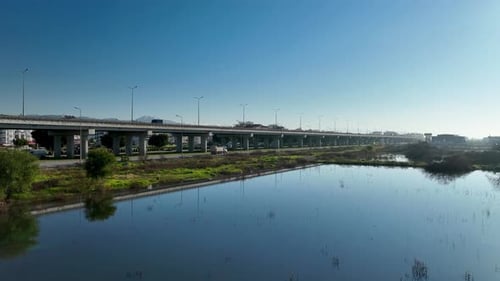 Traffic in the reflection of water aerial view 4 K