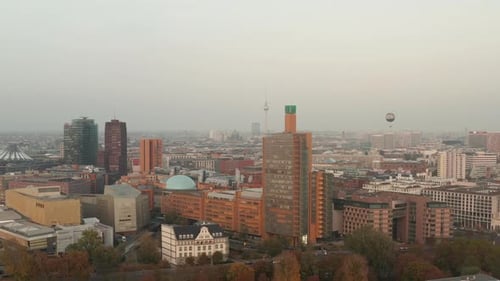 AERIAL: View Over Berlin, Germany Cityscape with Alexanderplatz TV Tower and WELT Balloon in