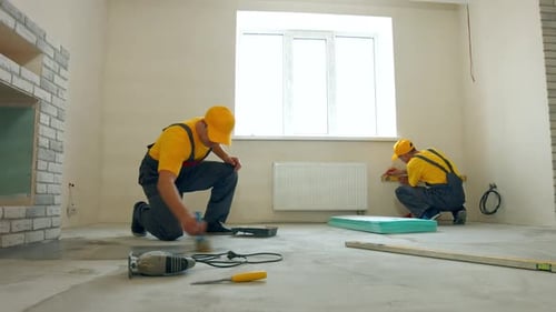 Two Men Working in Home Remodeling Project