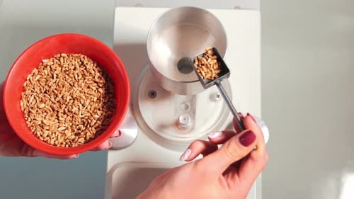 Grains Being Poured Into Scientific Device in Lab