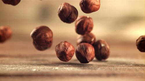 Shelled Hazelnuts Falling in Slow Motion