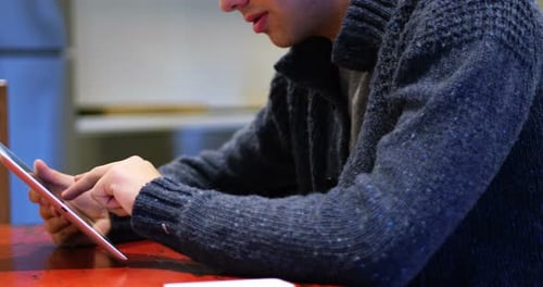 Man Using Tablet Device Indoors