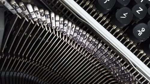 Mechanism of a retro typewriter. Old typewriter hammers. Close up.