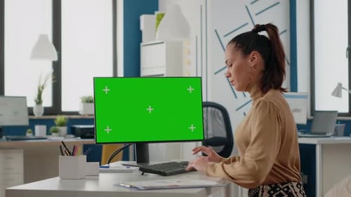 Employee Working with Green Screen on Computer