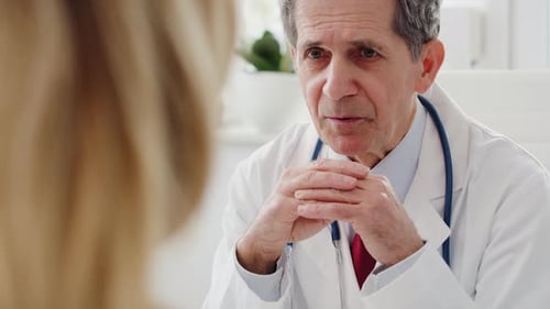 Handheld view of doctor discussing his medical options. Shot with RED helium camera in 8K