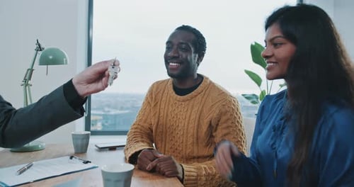Close up of couple getting new house keys