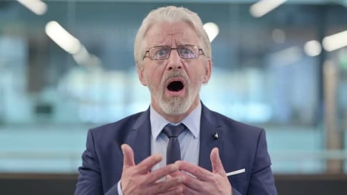 Man Looking Shocked and Surprised in Corporate Setting