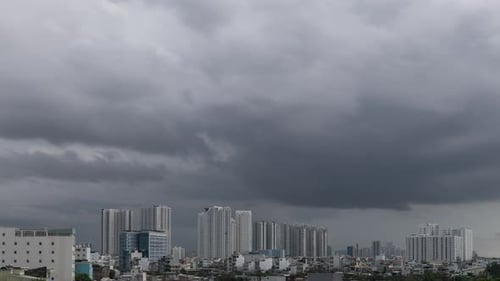 Generic urban cloudy day scene time lapse featuring high rise buildings and a range of clouds from s