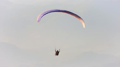 Paragliders Flying With Paragliding in Sky Over the Forest, Mountain Top and Sea