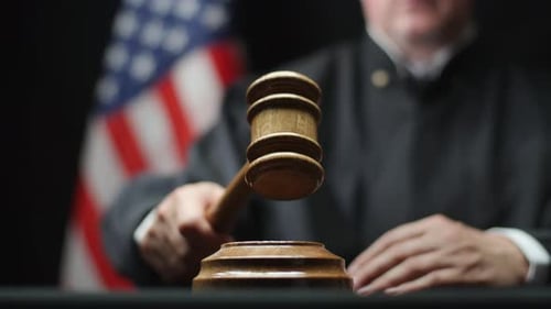 Close-up of Judge Hitting Gavel in Courtroom