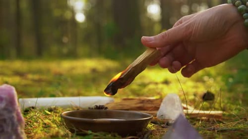 Woman or Witch Performing Magic Ritual in Forest