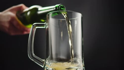 Beer Being Poured Into a Mug Close Up
