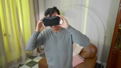 Man Experiences Virtual Reality With VR Headset