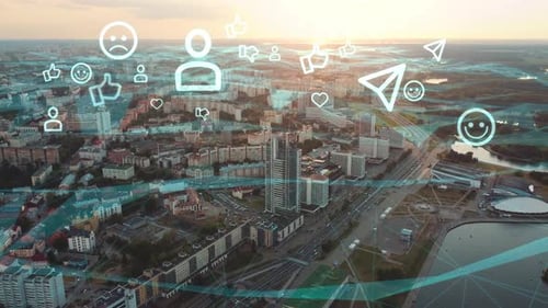 Flight over the city with a wireless network connection with social media icons and smiles.