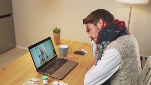 Young Adult Telemedicine Consultation with Doctor on Laptop