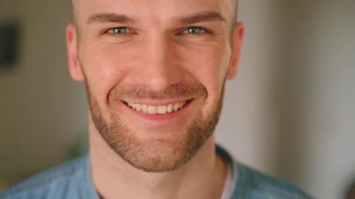 Man Smiling Close Up At The Camera